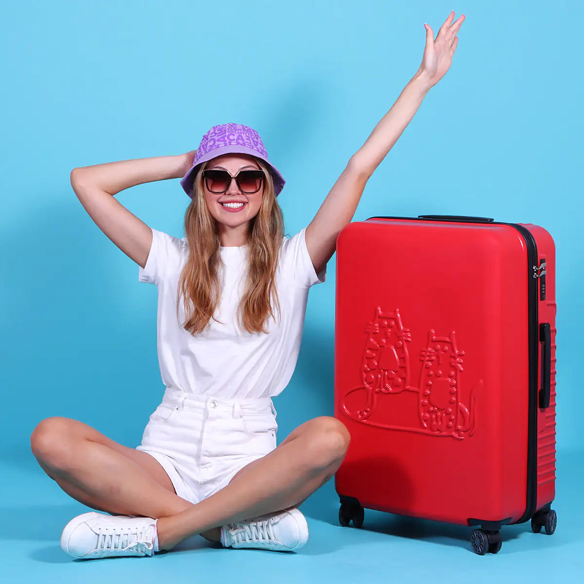 Woman with a red suitcase on a blue background