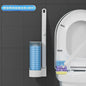 Hand using disposable toilet brush in toilet bowl