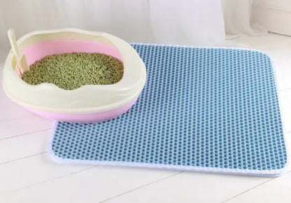 Durable litter mat placed under litter box to prevent floor mess