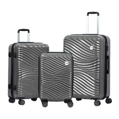 Set of three gray suitcases with a wavy pattern on a white background