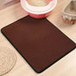 Non-slip litter mat placed under a litter box for mess-free floors